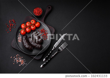 Delicious black blood sausage or black pudding with spices and herbs 102431133