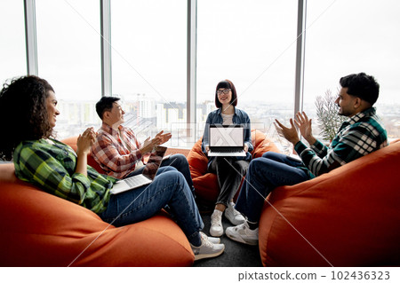 Architects applauding expert on presentation with blueprints 102436323