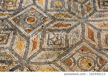 Ancient stone mosaic floor in ruined houses of Ephesus, Turkey 102440213