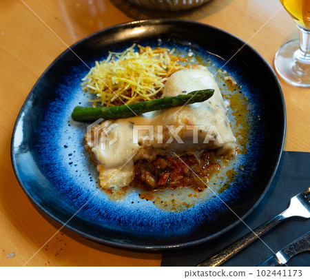 Cod fillet on vegetable ratatouille with chorizo, gratin 102441173