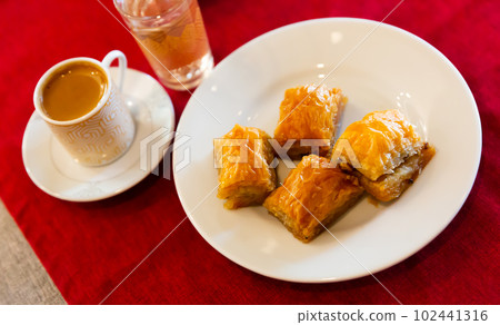 Traditional Turkish baklava and cup of coffee Traditional Turkish baklava and cup of coffee 102441316