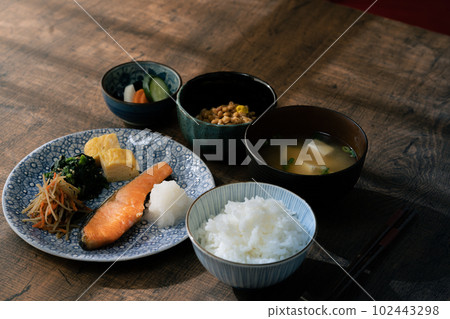 A Japanese breakfast served on a table in the morning sun 102443298