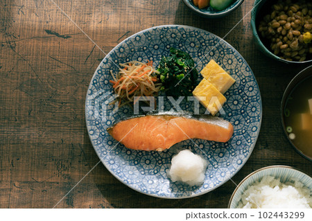 A Japanese breakfast served on a table in the morning sun 102443299