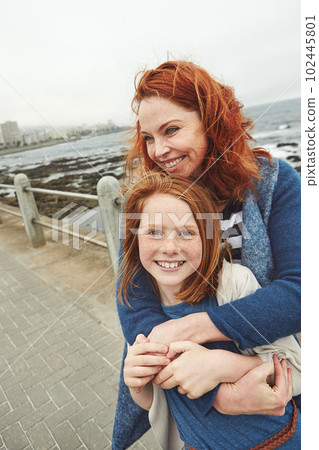 Our time together is priceless. a mature woman and her young daughter at the waterfront. 102445801