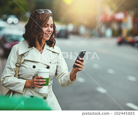 Living and loving the city life. a happy young woman going for a walk around the city. 102445883