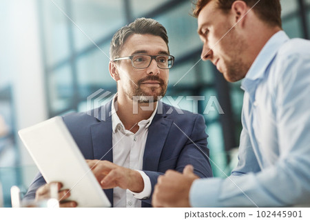 Working towards a common goal. two businessmen meeting in the office. 102445901