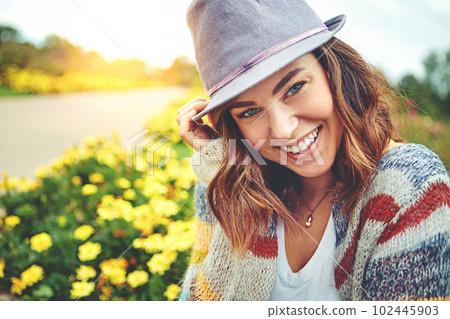 Im having a great day being outdoors. Portrait of an attractive young woman enjoying a spring day outdoors. Im having a great day being outdoors. Portrait of an attractive young woman enjoying a spring day outdoors. 102445903