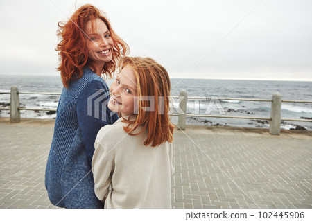 Together is a wonderful place to be. a mature woman and her young daughter at the waterfront. 102445906