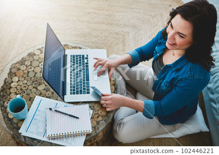There was something else I wanted to buy...High angle shot of an attractive young woman shopping online using her laptop. There was something else I wanted to buy...High angle shot of an attractive young woman shopping online using her laptop. 102446221