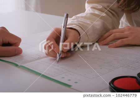 woman writing divorce papers woman writing divorce papers 102446779