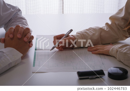 woman writing divorce papers woman writing divorce papers 102446783