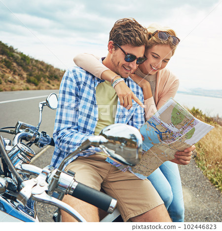 Go wherever love takes you. a couple using a map while out on a road trip. Go wherever love takes you. a couple using a map while out on a road trip. 102446823