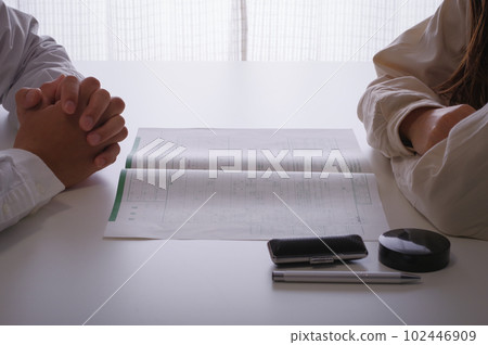couple looking at divorce papers couple looking at divorce papers 102446909