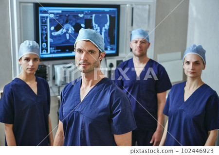 Our goal is to save as many lives possible. Portrait of a team of surgeons in a hospital. 102446923