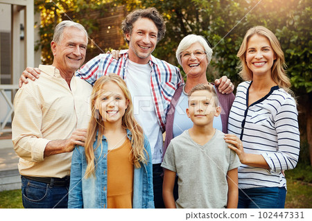 The picture perfect family. Cropped portrait of a family of six standing outside. 102447331