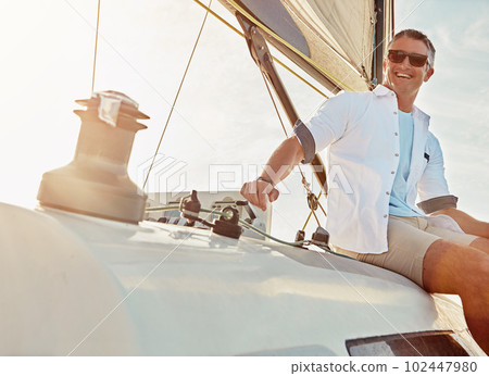 Go where your heart takes you. a man out on a boat trip alone. 102447980