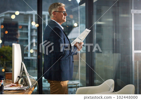 Work until youve earned it. a dedicated businessman working alone in his office after hours. Work until youve earned it. a dedicated businessman working alone in his office after hours. 102448000