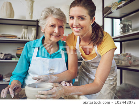 Time to play with clay. a senior woman making a ceramic pot at a pottery class. 102448072