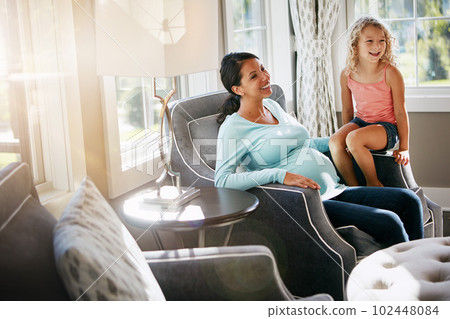 My second pregnancy is just as special as my first. a pregnant woman spending time with her daughter at home. My second pregnancy is just as special as my first. a pregnant woman spending time with her daughter at home. 102448084