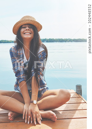 Summer is all I need. an attractive young woman enjoying a day on the beach. Summer is all I need. an attractive young woman enjoying a day on the beach. 102448552
