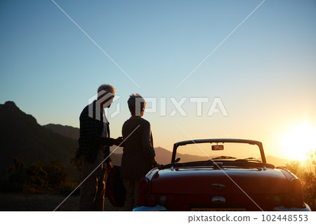 Life looks amazing from here. an affectionate senior couple enjoying the sunset during a roadtrip. Life looks amazing from here. an affectionate senior couple enjoying the sunset during a roadtrip. 102448553