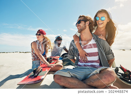 What an awesome day out in the desert. a group of young friends sandboarding in the desert. What an awesome day out in the desert. a group of young friends sandboarding in the desert. 102448874