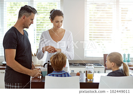 What would you like for breakfast. a family having breakfast together. What would you like for breakfast. a family having breakfast together. 102449011