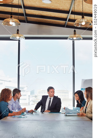 The teams talking strategy. a group of businesspeople in a meeting. The teams talking strategy. a group of businesspeople in a meeting. 102449019