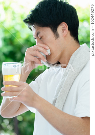 man drinking beer after exercise man drinking beer after exercise 102449279