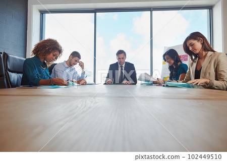 The teams talking strategy. a group of businesspeople in a meeting. 102449510