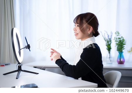 A Japanese woman with a gentle atmosphere performs live distribution from her home A Japanese woman with a gentle atmosphere performs live distribution from her home 102449670