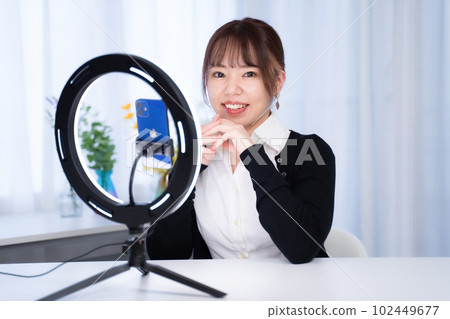 A Japanese woman with a gentle atmosphere performs live distribution from her home A Japanese woman with a gentle atmosphere performs live distribution from her home 102449677