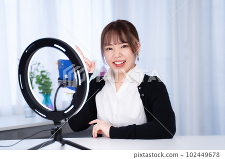 A Japanese woman with a gentle atmosphere performs live distribution from her home A Japanese woman with a gentle atmosphere performs live distribution from her home 102449678