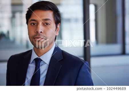 Corporate confidence. Cropped portrait of a businessman standing in his office. Corporate confidence. Cropped portrait of a businessman standing in his office. 102449689