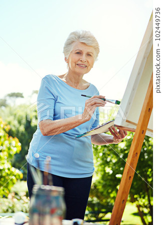 Nature is my inspiration. Cropped portrait of a senior woman painting in the park. 102449736