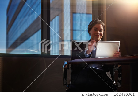 Sheer persistence is the difference between success and failure. a young woman using her digital tablet at her desk. 102450301
