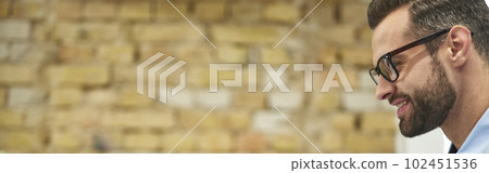 Confident boss meeting online with his employees 102451536