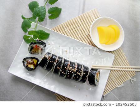 Korean roll Gimbap(kimbob) made from steamed white rice (bap) and various other ingredients Korean roll Gimbap(kimbob) made from steamed white rice (bap) and various other ingredients 102452603