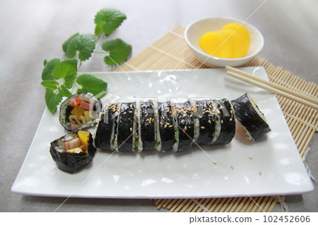 Korean roll Gimbap(kimbob) made from steamed white rice (bap) and various other ingredients 102452606