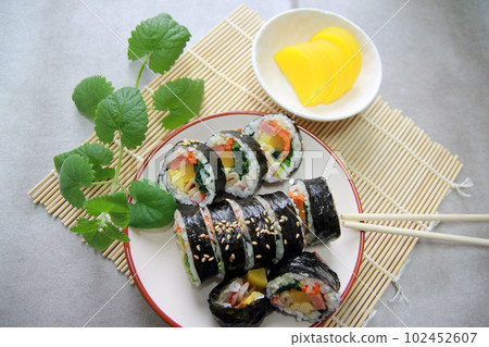 Korean roll Gimbap(kimbob) made from steamed white rice (bap) and various other ingredients Korean roll Gimbap(kimbob) made from steamed white rice (bap) and various other ingredients 102452607