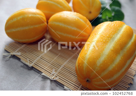 Sweet and crunchy Korean specialty Seongju melon summer fruit concept 102452768