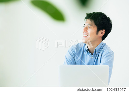 man working on computer at home man working on computer at home 102455957
