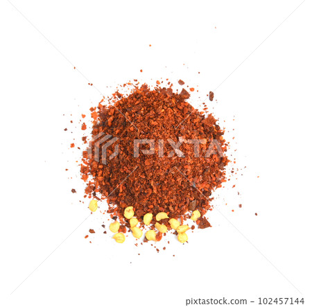 dried red chili flakes and seeds isolated on white background, top view dried red chili flakes and seeds isolated on white background, top view 102457144
