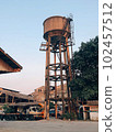 vintage water tank  on truck stop 102457512
