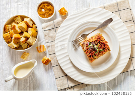 Tasty Strata with meat, mushrooms, cheese, onion Tasty Strata with meat, mushrooms, cheese, onion 102458155