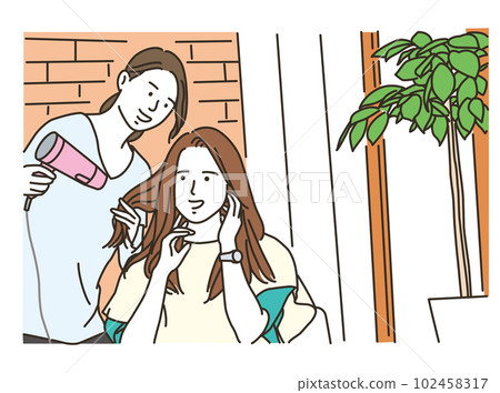 A woman getting her hair dried with a hairdryer A woman getting her hair dried with a hairdryer 102458317
