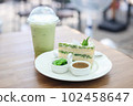 Green Tea Cake in a White Plate, eaten with green tea in the summer to refresh. Selective focus 102458647