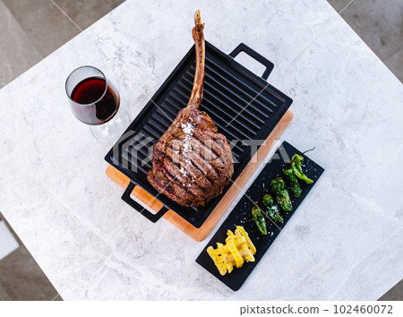 Grilled meat served with wine in bar Grilled meat served with wine in bar 102460072