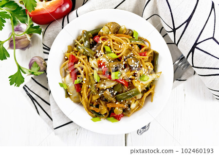 Spaghetti buckwheat with vegetables in plate on board top Spaghetti buckwheat with vegetables in plate on board top 102460193