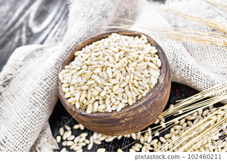 Spelled in bowl on dark board 102460211